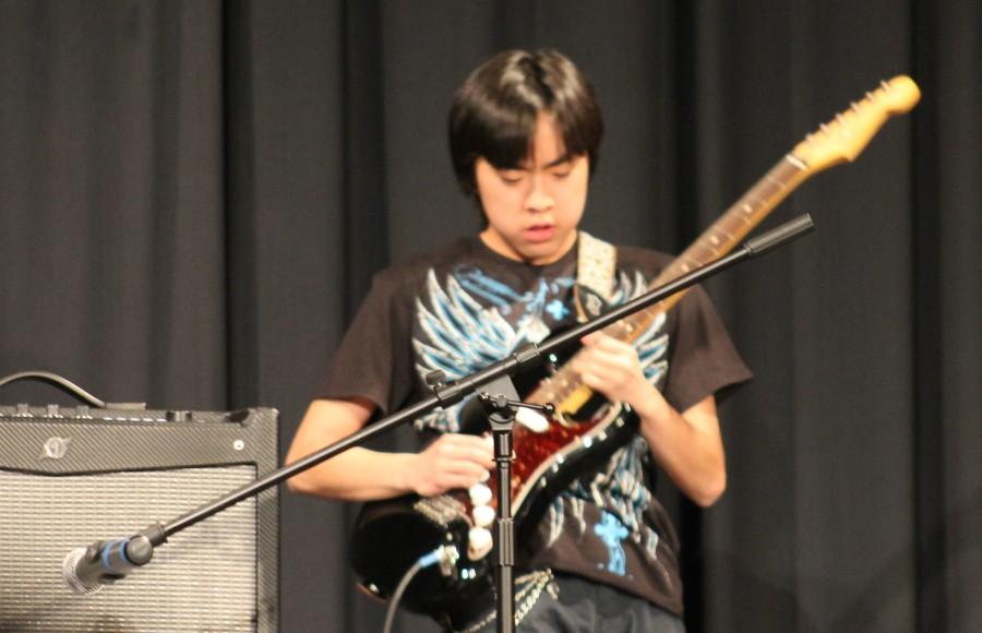 Freshman Luke Miyazaki rocked out with several hair flips along with dramatic swings of his guitar as he played  Pink Floyd’s “Crazy."
