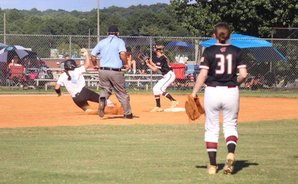 Freshman Alaina Gettinger slides into 3rd base during Monday’s game against Whitewater. Freshman Campbell Hudgens had a two-RBI hit that won the game for Starr’s Mill, 8-7.