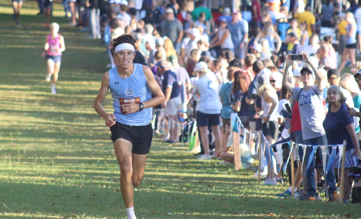 Junior Nate Pecetti nears the finish line. Both varsity teams, while performing well, show a need for improvement early in the season. The boys team placed 3rd while the girls placed 8th.