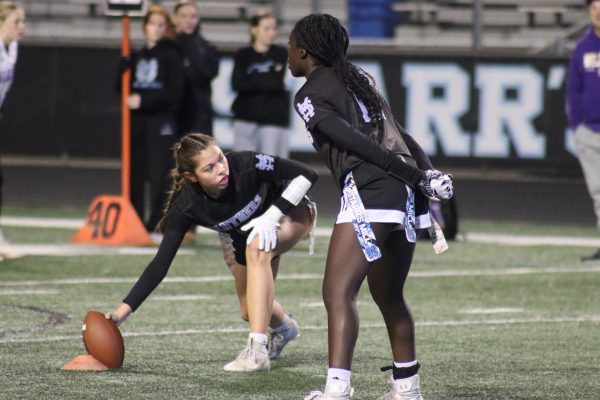 Sophomores Nani Serapion and Raegan Collins prepare for a play on offense. The panther flag football team has had an incredible season, going 17-3 overall and ending area play undefeated.