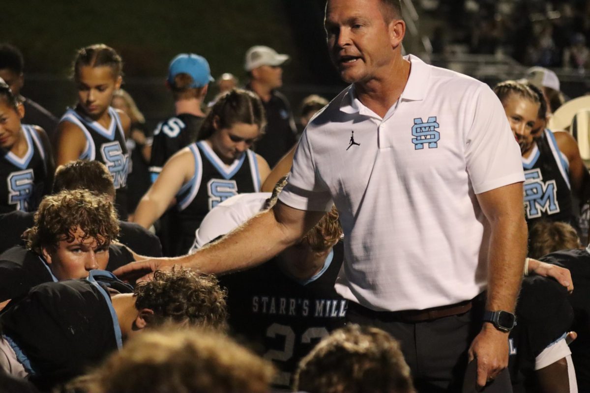 Head coach David Cooper talks to the team after a game. He wrapped up his first season as head coach with the team tying or breaking 22 team or individual records. The Panthers finished the season 10-2 after losing to Cartersville in the second round of AAAA state playoffs.