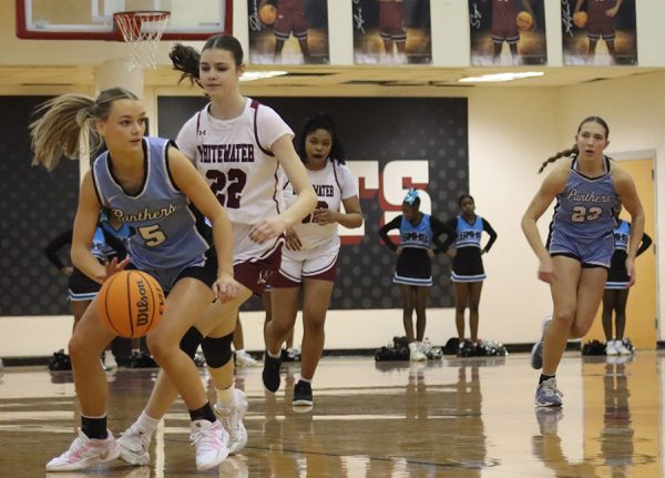 Freshman Aftyn Heiden dribbles toward the basket. She contributed 12 points in the team’s 70-8 win over Whitewater on January 18.