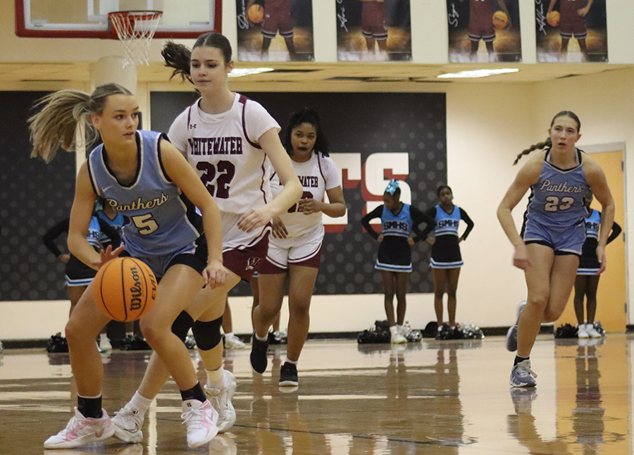 Freshman Aftyn Heiden dribbles toward the basket. She contributed 12 points in the team’s 70-8 win over Whitewater on January 18.