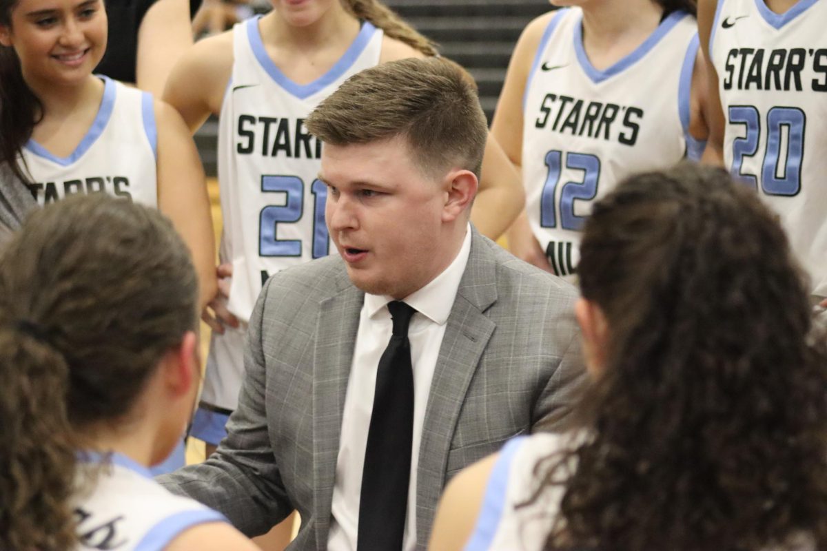 New head coach Brandon Cerezola talks to the Lady Panthers during their game against Northside. Cerezola is one of three coaches that this year's seniors have played under in four years.