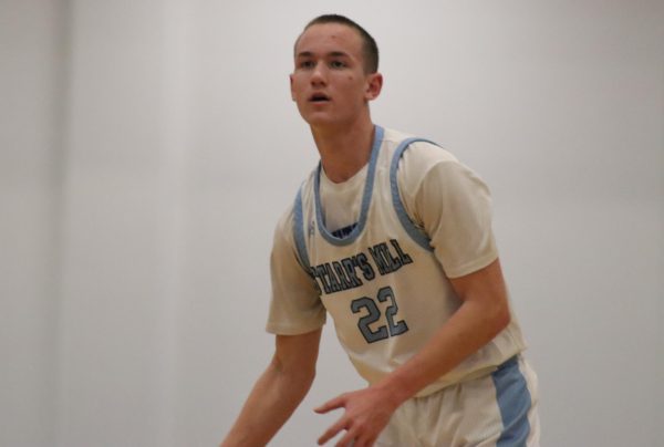 Sophomore Tyler Griffin looks to pass as he moves the ball up the court. The Panthers showcased the depth of their skills against the Tigers, winning 76-55.