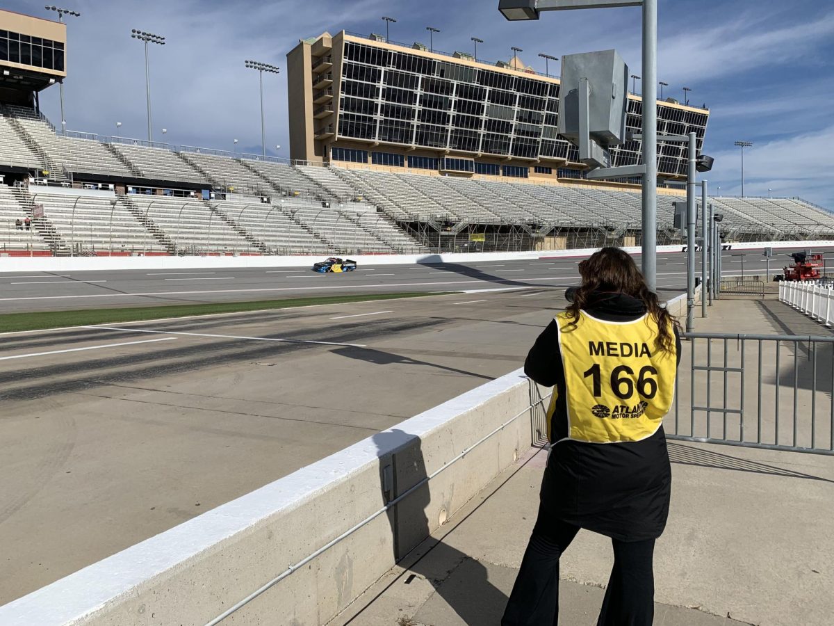 Here I am taking one of my first photos of a truck driving on the track at Atlanta Motor Speedway. If you allow it, sports photography can be an experience of exploration and self-discovery.