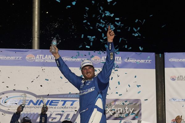 Austin Hill celebrates in Victory Lane after winning the Bennett Transportation & Logistics 250. This is the 5th time he has won at Atlanta in 7 races.