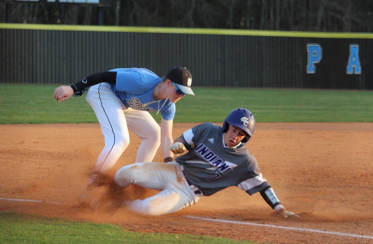 East Coweta runner attempts to steal third, but successful fielding prevented the advance. This play secured the momentum, allowing the Panthers to tie the game late.