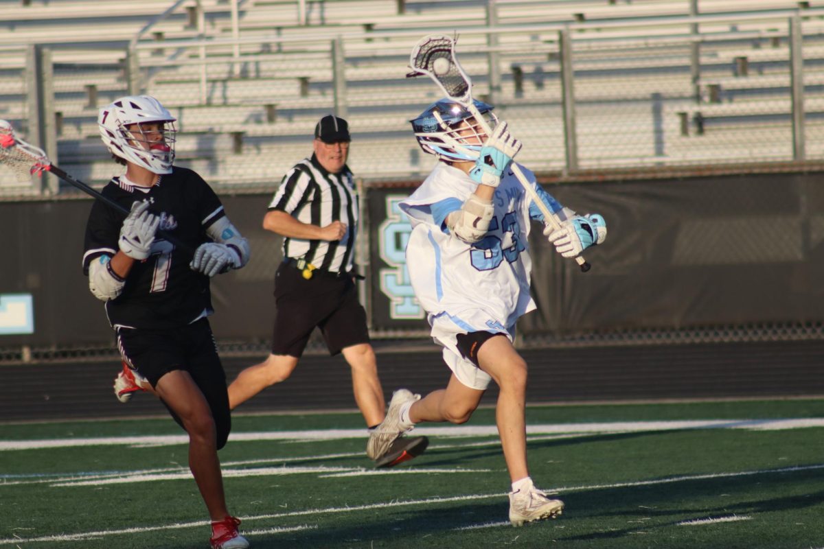 Freshman Luca Jimenez takes the ball down the field. The JV boys lacrosse team remained undefeated after beating the Whitewater Wildcats, 5-3.