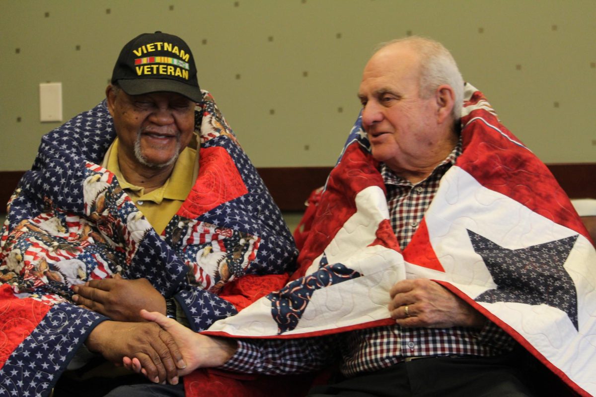 Two Vietnam veterans shake hands after getting awarded with their Quilt of Valor. The Quilts of Valor ceremony took place on March 15 at Central Library in Newnan. 