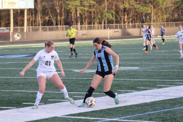 Junior forward Kendra Ivaska attempts to take a shot at the opposing goal. Ivaska recently broke the all-time school record for most goals scored. Her goals currently stand at 77 and counting.